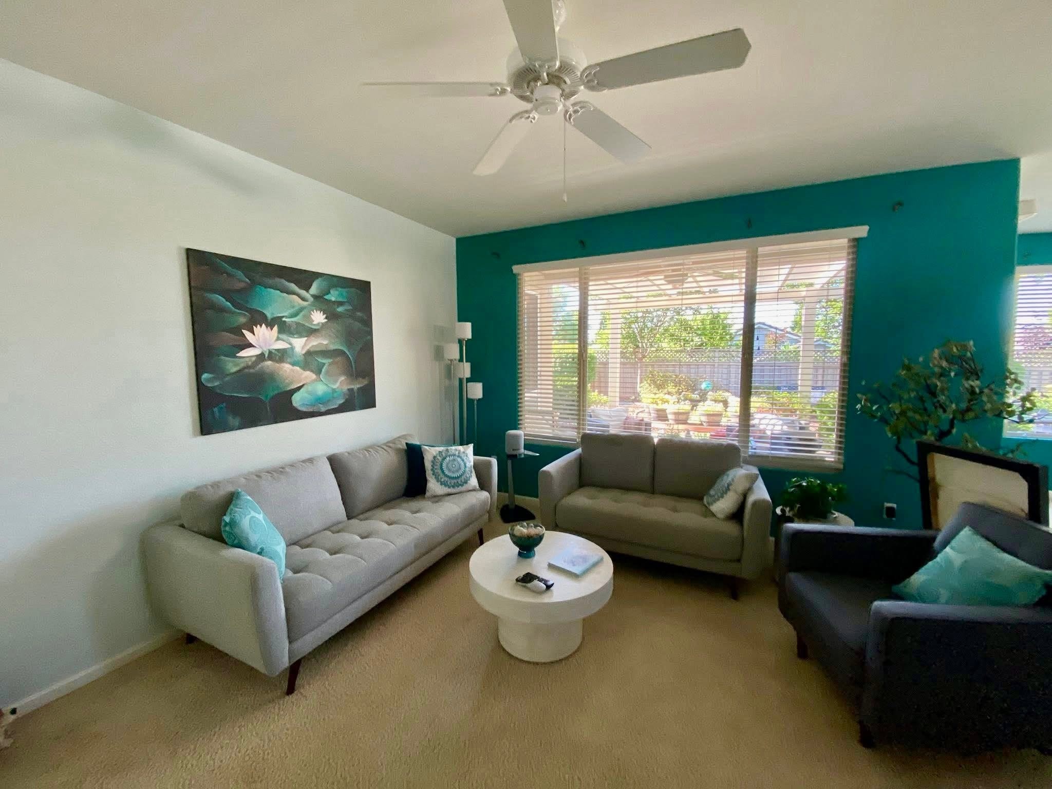 Living room with teal accent wall
