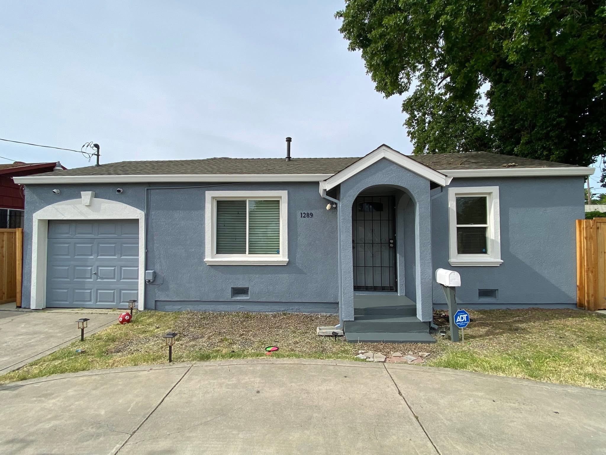 Residential home exterior blue-gray repaint